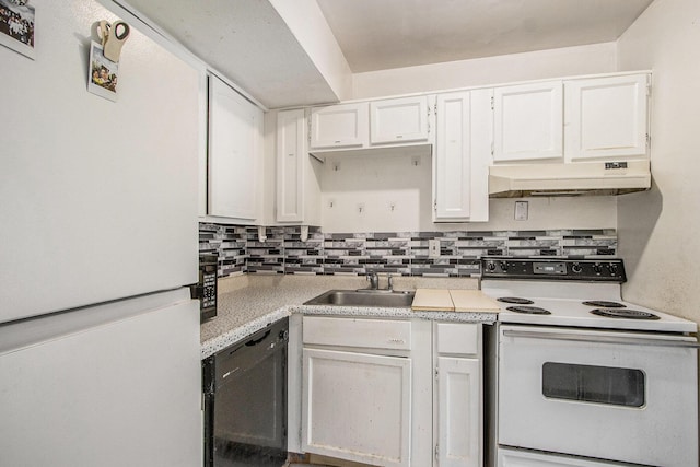 3407 Kenbrooke Ct, Kalamazoo, MI 49006 - kitchen with white appliances, under cabinet range hood, a sink, light countertops, and white cabinets