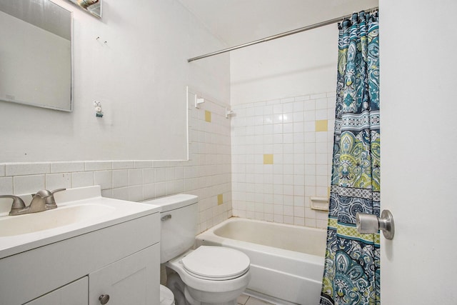 3407 Kenbrooke Ct, Kalamazoo, MI 49006 - bathroom with tile walls, toilet, vanity, shower / bathtub combination with curtain, and decorative backsplash