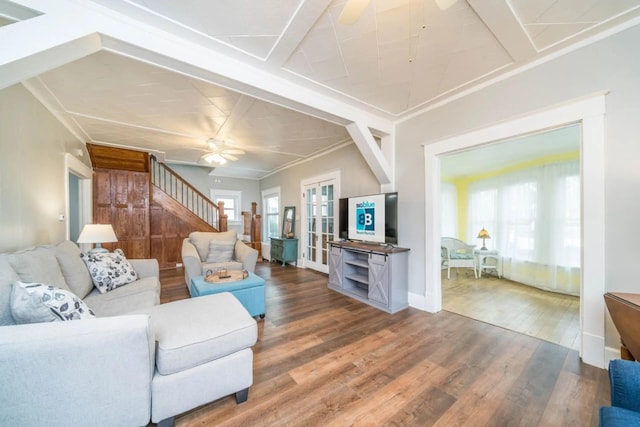 724 Wilson St, South Haven, MI 49090 - living room featuring a ceiling fan, wood finished floors, stairway, and baseboards