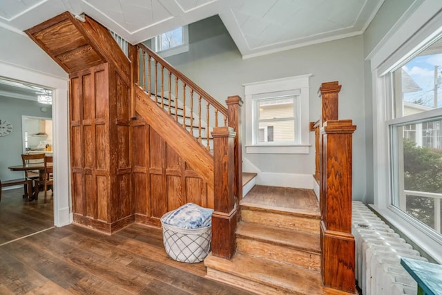 724 Wilson St, South Haven, MI 49090 - stairs featuring hardwood / wood-style floors, baseboards, and ornamental molding