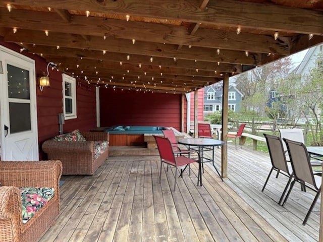 724 Wilson St, South Haven, MI 49090 - wooden terrace with a covered hot tub and outdoor dining area