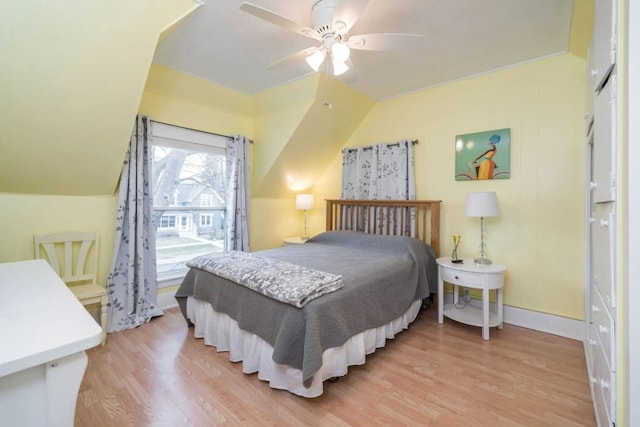 724 Wilson St, South Haven, MI 49090 - bedroom with light wood-style floors, a ceiling fan, and baseboards