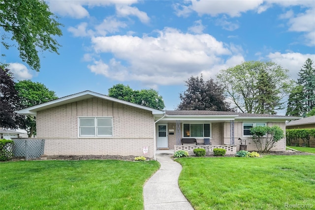 11523 Jenny Dr, Warren, MI 48093 - ranch-style home featuring brick siding, covered porch, and a front lawn