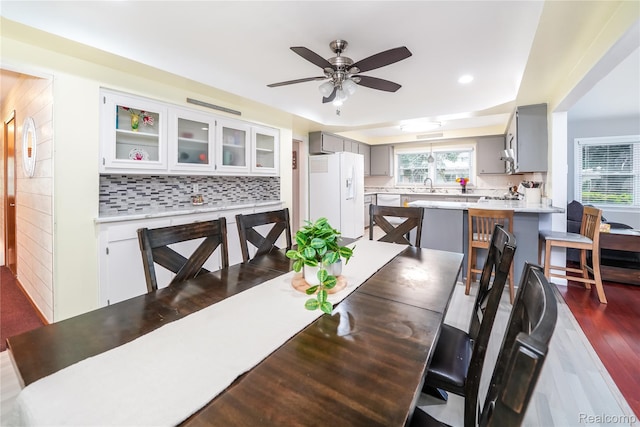 11523 Jenny Dr, Warren, MI 48093 - dining space featuring ceiling fan, recessed lighting, dark wood-style floors, and a tray ceiling