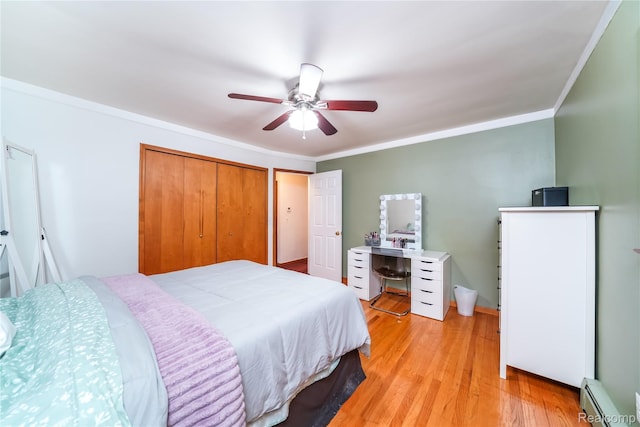 11523 Jenny Dr, Warren, MI 48093 - bedroom with a baseboard radiator, light wood-style flooring, a ceiling fan, a closet, and ornamental molding