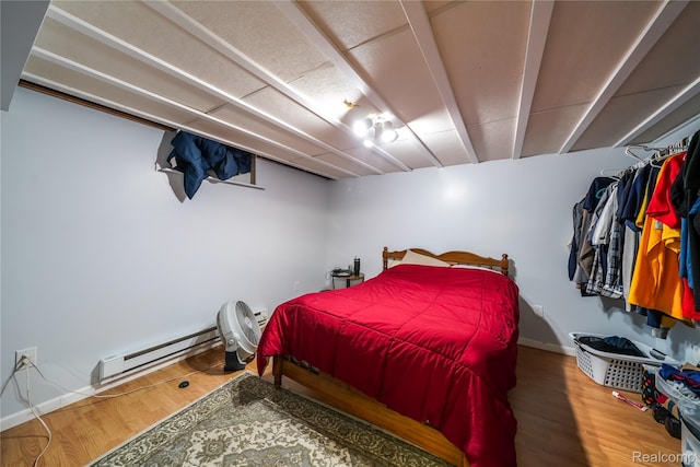 11523 Jenny Dr, Warren, MI 48093 - bedroom with a baseboard radiator, wood finished floors, and baseboards