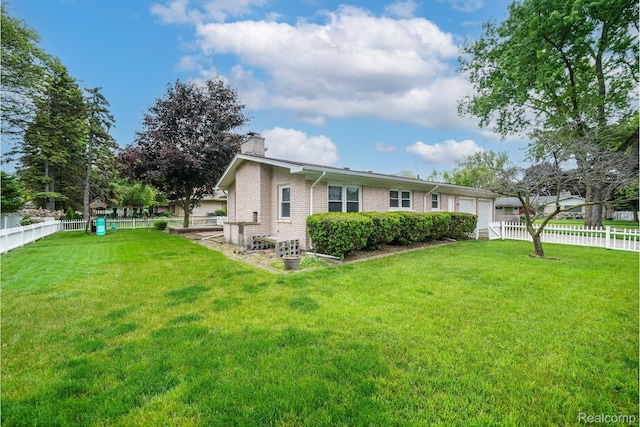 11523 Jenny Dr, Warren, MI 48093 - view of front of property with a chimney, brick siding, and an attached garage