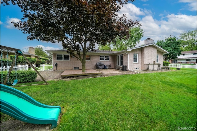 11523 Jenny Dr, Warren, MI 48093 - rear view of property with brick siding, a patio, a chimney, and a playground