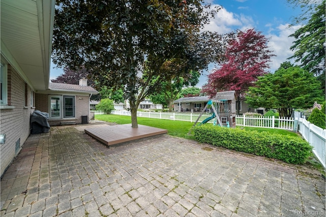 11523 Jenny Dr, Warren, MI 48093 - view of patio with a playground and grilling area