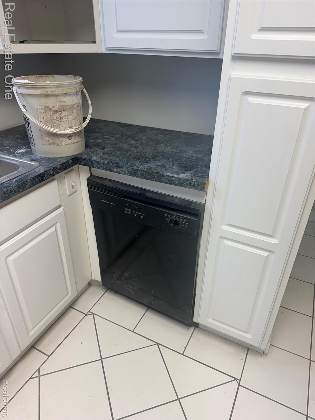 16718 Fenmore St, Detroit, MI 48235 - kitchen view of dishwasher, white cabinetry, and dark countertops