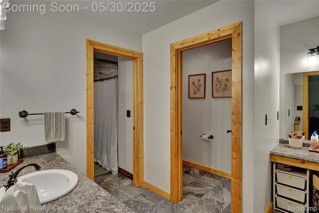 5257 Brookshire Dr, Almont, MI 48003 - full bathroom with vanity, baseboards, and marble finish floors