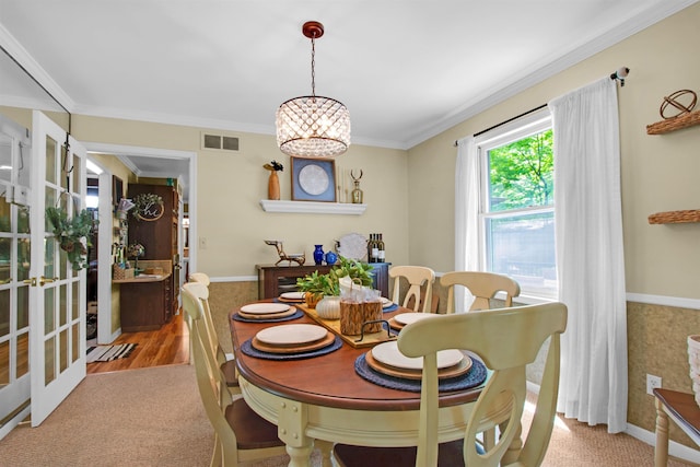 1330 Kings Carriage Rd, Grand Blanc, MI 48439 - dining area with carpet flooring, crown molding, baseboards, and a chandelier
