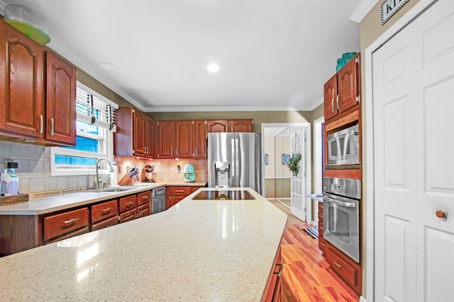 1330 Kings Carriage Rd, Grand Blanc, MI 48439 - kitchen with appliances with stainless steel finishes, ornamental molding, a sink, backsplash, and light stone countertops