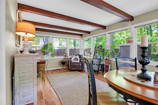 1330 Kings Carriage Rd, Grand Blanc, MI 48439 - sunroom / solarium featuring beamed ceiling, healthy amount of natural light, wood finished floors, and a deck