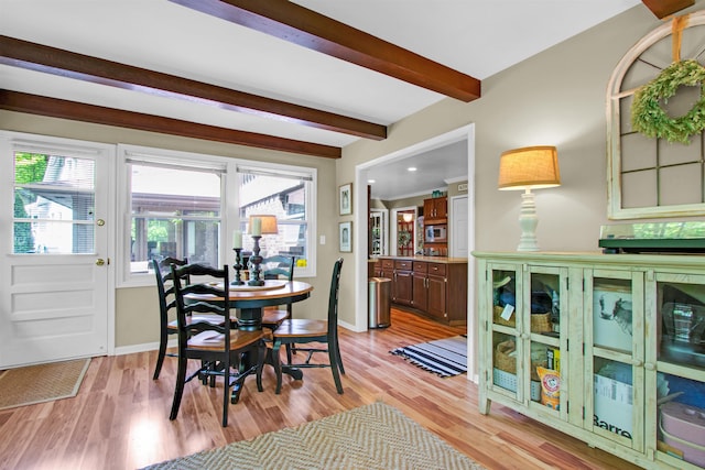 1330 Kings Carriage Rd, Grand Blanc, MI 48439 - dining room with beamed ceiling, light wood-type flooring, and baseboards