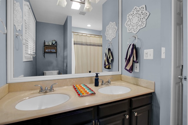 1330 Kings Carriage Rd, Grand Blanc, MI 48439 - bathroom featuring double vanity and toilet