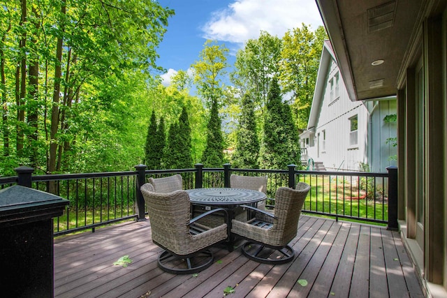 1330 Kings Carriage Rd, Grand Blanc, MI 48439 - wooden deck featuring outdoor dining space