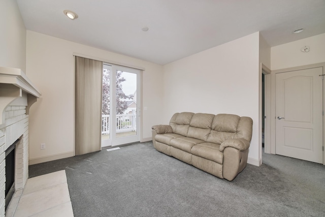 70 Spinnaker Dr, Manistee, MI 49660 - carpeted living area featuring a fireplace and baseboards