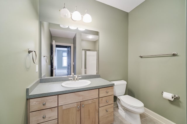 70 Spinnaker Dr, Manistee, MI 49660 - bathroom with toilet, vanity, tile patterned flooring, a stall shower, and baseboards