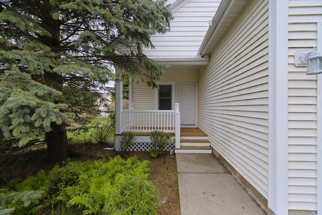 70 Spinnaker Dr, Manistee, MI 49660 - view of exterior entry with a porch
