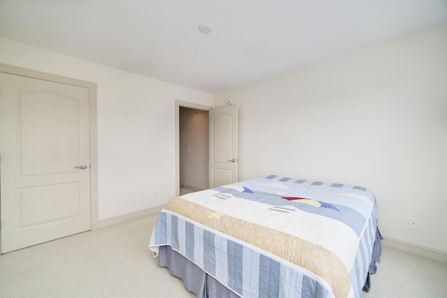 70 Spinnaker Dr, Manistee, MI 49660 - bedroom featuring light colored carpet and baseboards