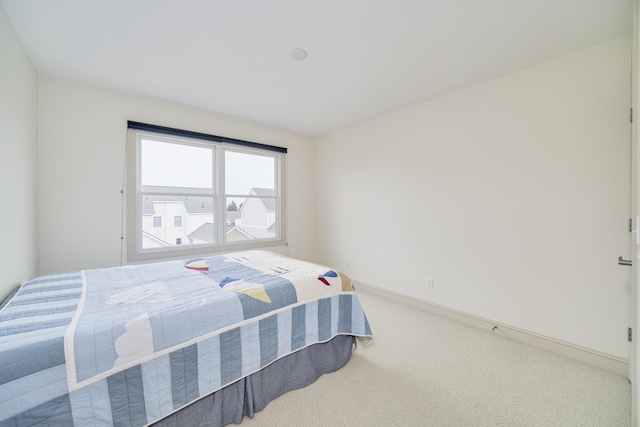 70 Spinnaker Dr, Manistee, MI 49660 - carpeted bedroom featuring baseboards