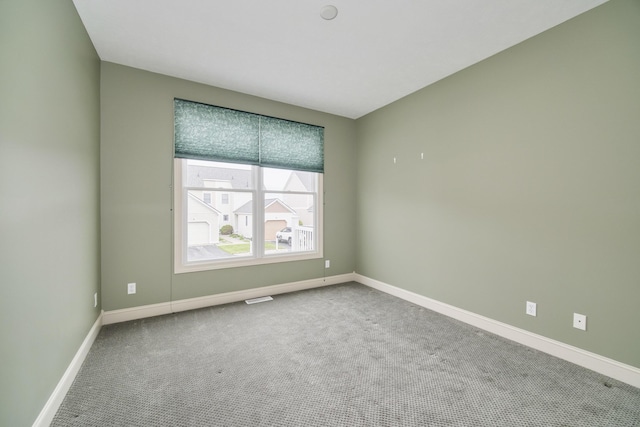 70 Spinnaker Dr, Manistee, MI 49660 - empty room with carpet floors and baseboards