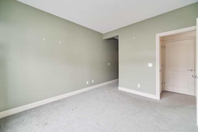 70 Spinnaker Dr, Manistee, MI 49660 - empty room with light colored carpet and baseboards