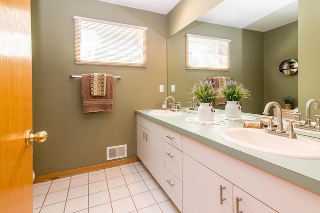 3007 Cedarbrook Rd, Ann Arbor, MI 48105 - bathroom featuring double vanity, tile patterned flooring, and baseboards