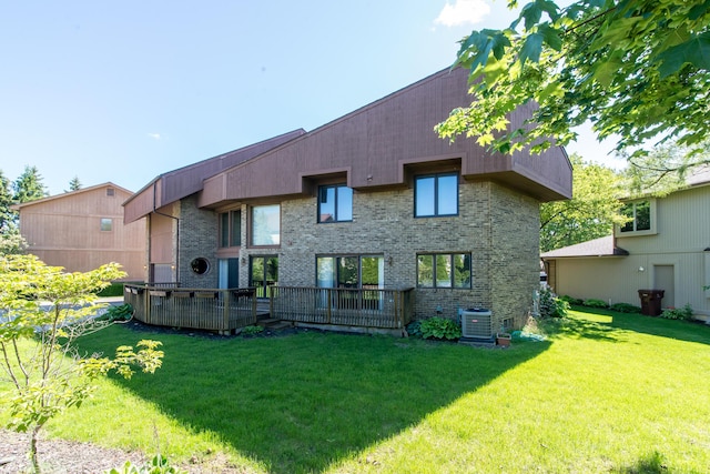 3007 Cedarbrook Rd, Ann Arbor, MI 48105 - rear view of property with a lawn, cooling unit, and brick siding