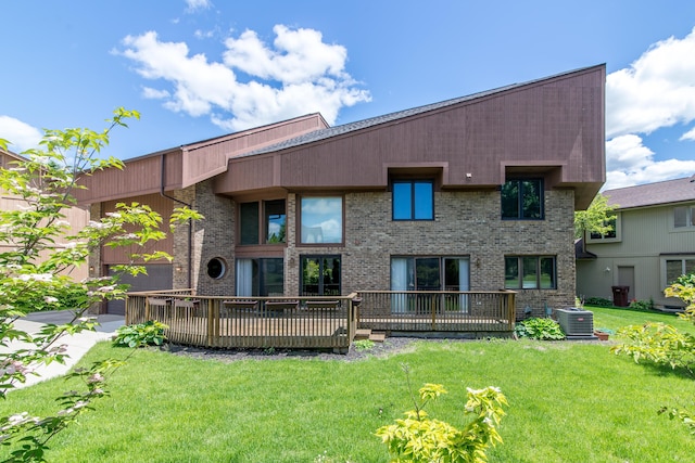 3007 Cedarbrook Rd, Ann Arbor, MI 48105 - back of house with cooling unit, a yard, a wooden deck, and brick siding