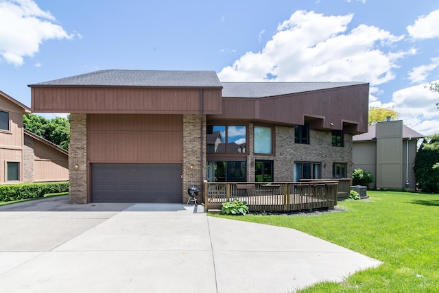 3007 Cedarbrook Rd, Ann Arbor, MI 48105 - view of front of property with a front yard, a garage, driveway, and brick siding