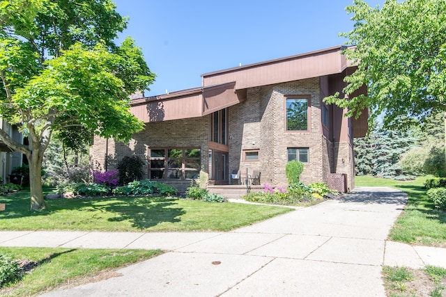 3007 Cedarbrook Rd, Ann Arbor, MI 48105 - view of front of house with a front lawn and brick siding