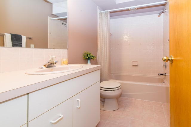3007 Cedarbrook Rd, Ann Arbor, MI 48105 - full bath with shower / bath combo, vanity, toilet, tile patterned flooring, and tasteful backsplash