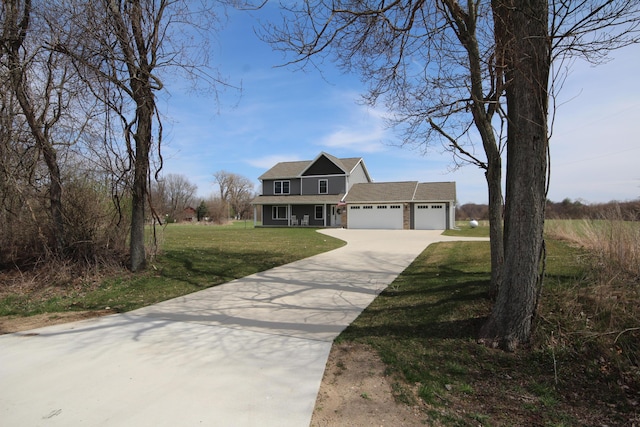 10141 S 33rd St, Vicksburg, MI 49097 - traditional home featuring a garage, driveway, a front lawn, and a shingled roof