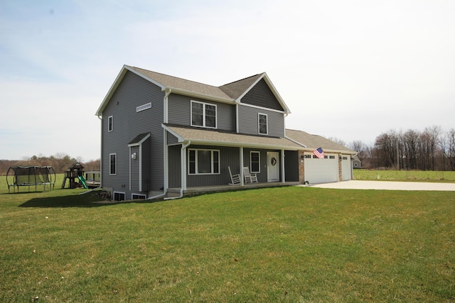 10141 S 33rd St, Vicksburg, MI 49097 - view of front of property with a porch, an attached garage, driveway, a front lawn, and a trampoline