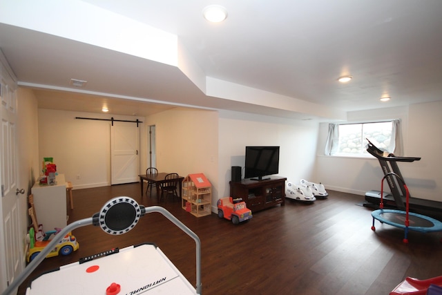 10141 S 33rd St, Vicksburg, MI 49097 - game room featuring a barn door, wood finished floors, baseboards, and recessed lighting