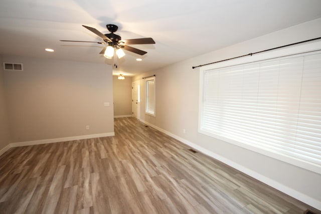 10141 S 33rd St, Vicksburg, MI 49097 - empty room featuring ceiling fan, wood finished floors, and recessed lighting