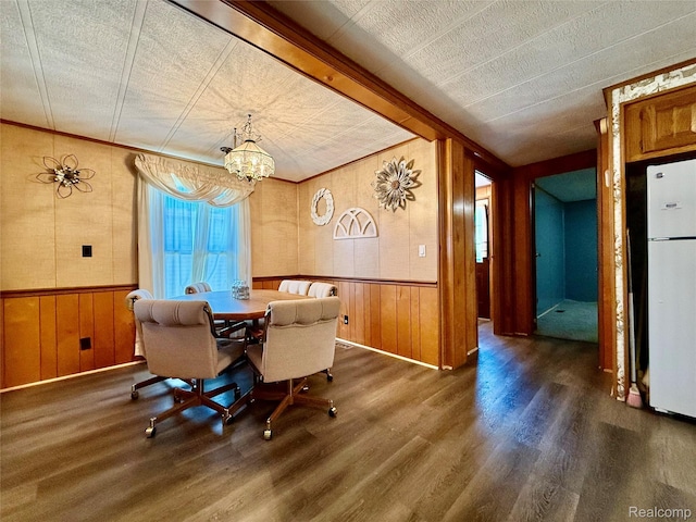 25654 Madison St, Novi, MI 48375 - dining room with wood walls, wood finished floors, a chandelier, and wainscoting