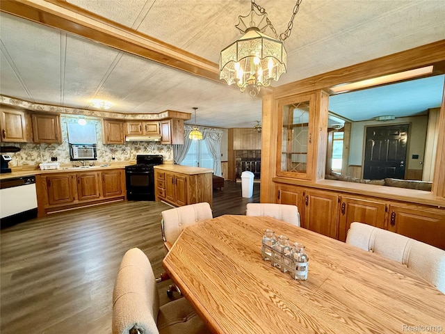 25654 Madison St, Novi, MI 48375 - dining area featuring dark wood finished floors and a chandelier