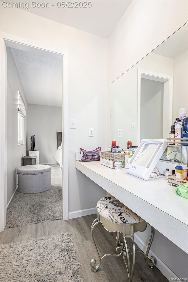 7453 Baldwin Rd, Swartz Creek, MI 48473 - bathroom featuring wood finished floors and baseboards