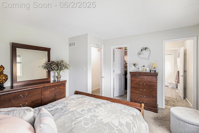 7453 Baldwin Rd, Swartz Creek, MI 48473 - bedroom with carpet flooring, a spacious closet, and baseboards