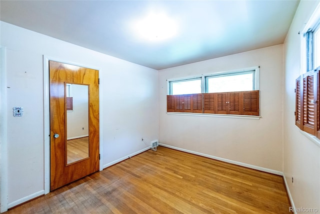 1019 Symes Ct, Royal Oak, MI 48067 - empty room featuring wood finished floors, healthy amount of natural light, and baseboards