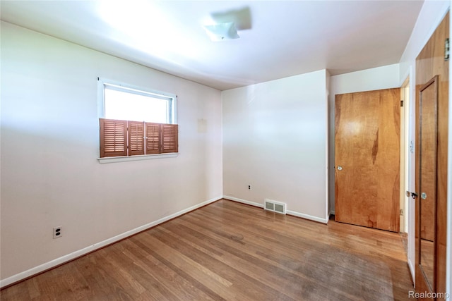 1019 Symes Ct, Royal Oak, MI 48067 - unfurnished bedroom featuring wood finished floors and baseboards