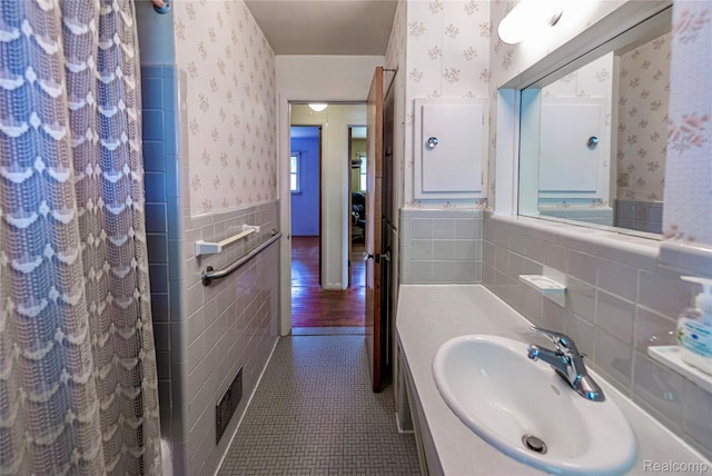 1019 Symes Ct, Royal Oak, MI 48067 - full bath featuring wallpapered walls, tile walls, a wainscoted wall, vanity, and tile patterned floors