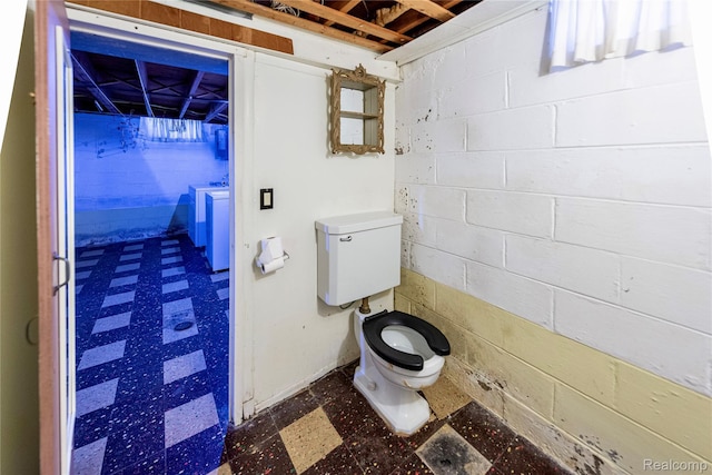 1019 Symes Ct, Royal Oak, MI 48067 - bathroom with tile patterned floors, toilet, and concrete block wall