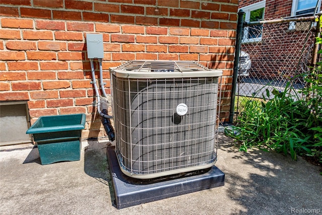 1019 Symes Ct, Royal Oak, MI 48067 - exterior view of central air condition unit and brick siding