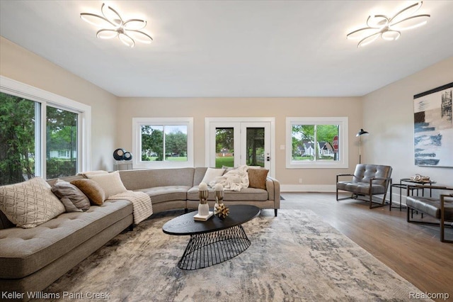 520 Kayser Ave, Birmingham, MI 48067 - living room featuring healthy amount of natural light, wood finished floors, and baseboards