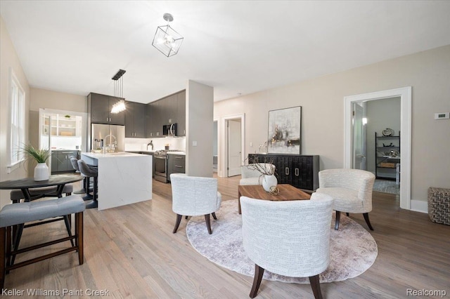 520 Kayser Ave, Birmingham, MI 48067 - living area with light wood-style floors