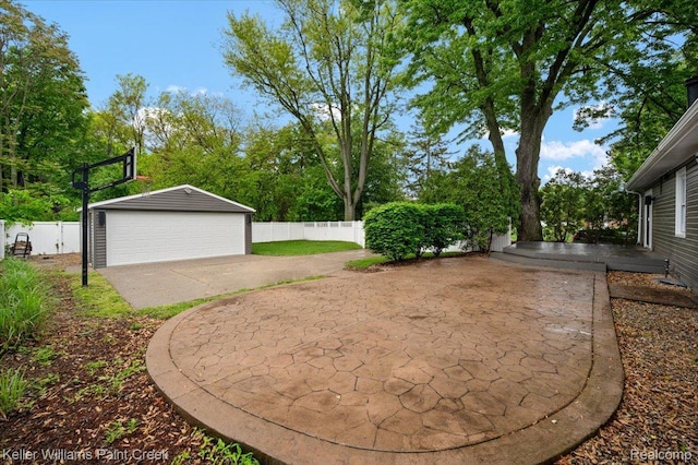 520 Kayser Ave, Birmingham, MI 48067 - view of yard featuring a garage, an outbuilding, view of scattered trees, and a patio area